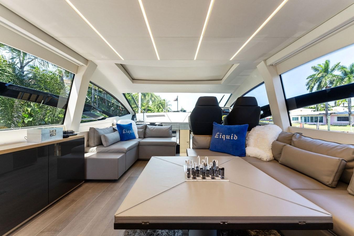 a modern looking living room aboard LIQUID Yacht for Sale