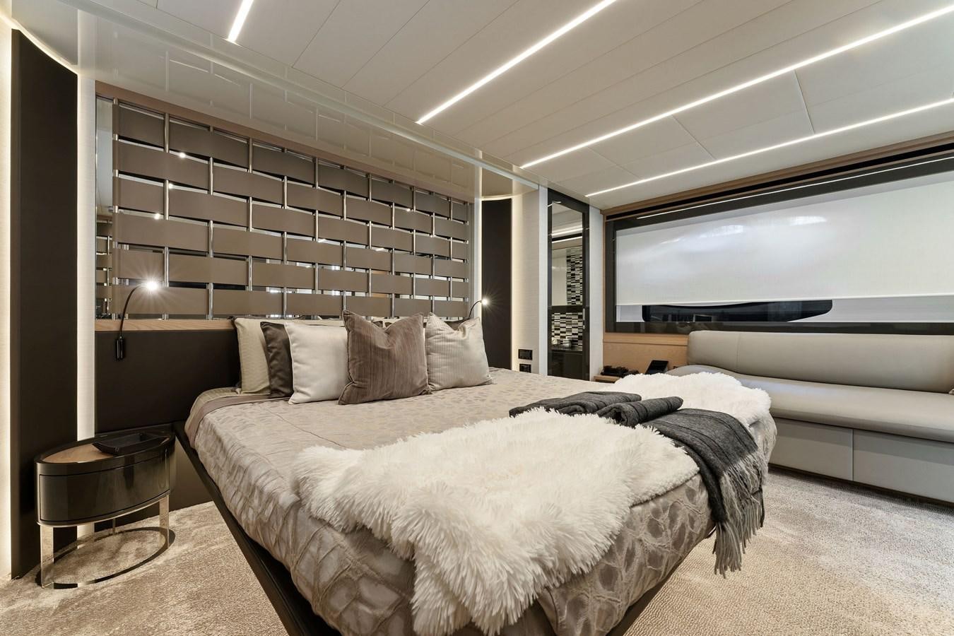 a bedroom with a large bed aboard LIQUID Yacht for Sale