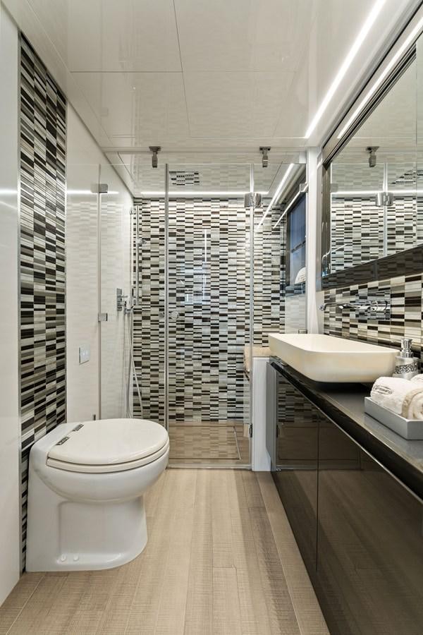 a bathroom with a large shower aboard LIQUID Yacht for Sale