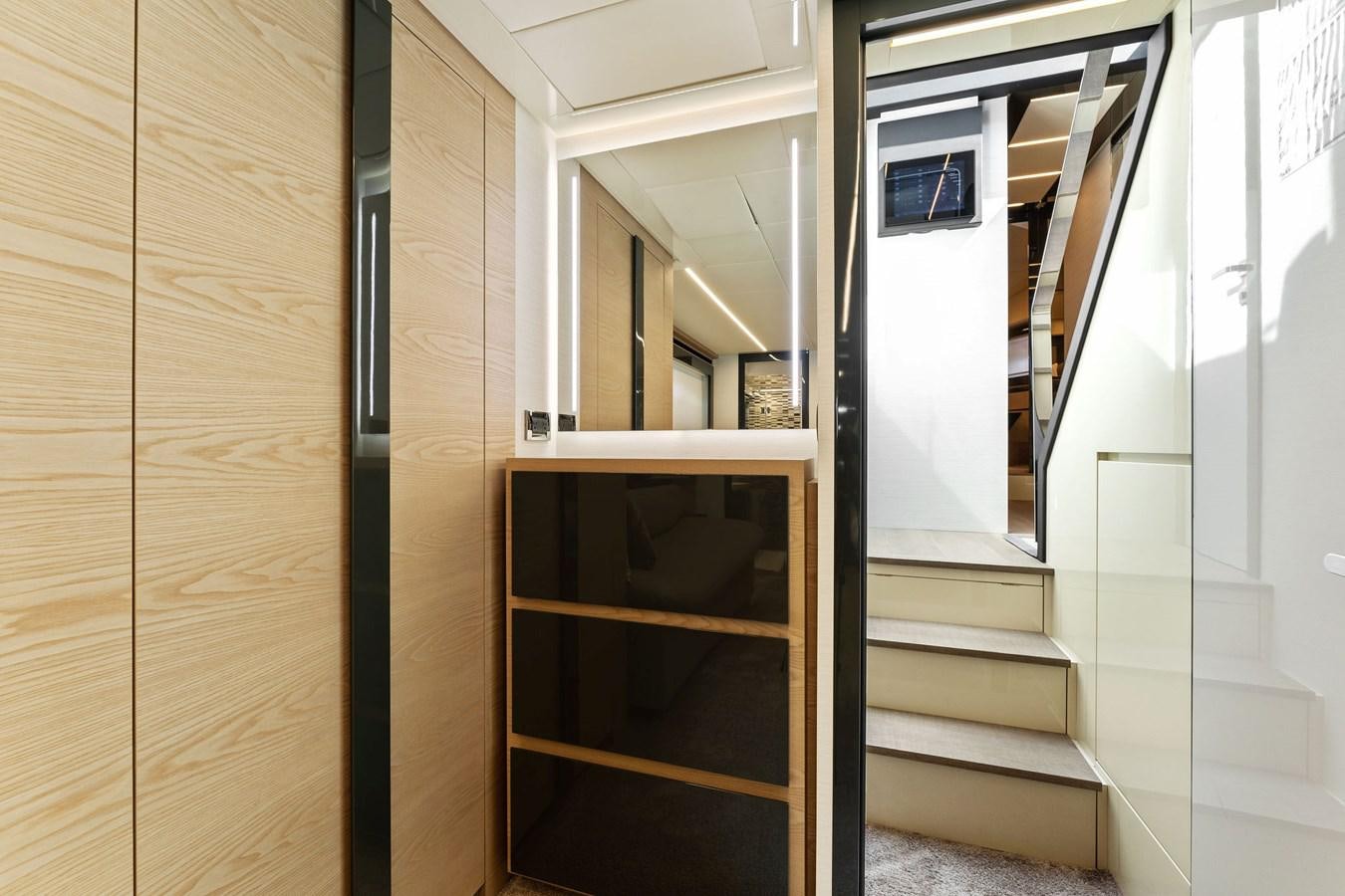 a wooden door leading to a room aboard LIQUID Yacht for Sale