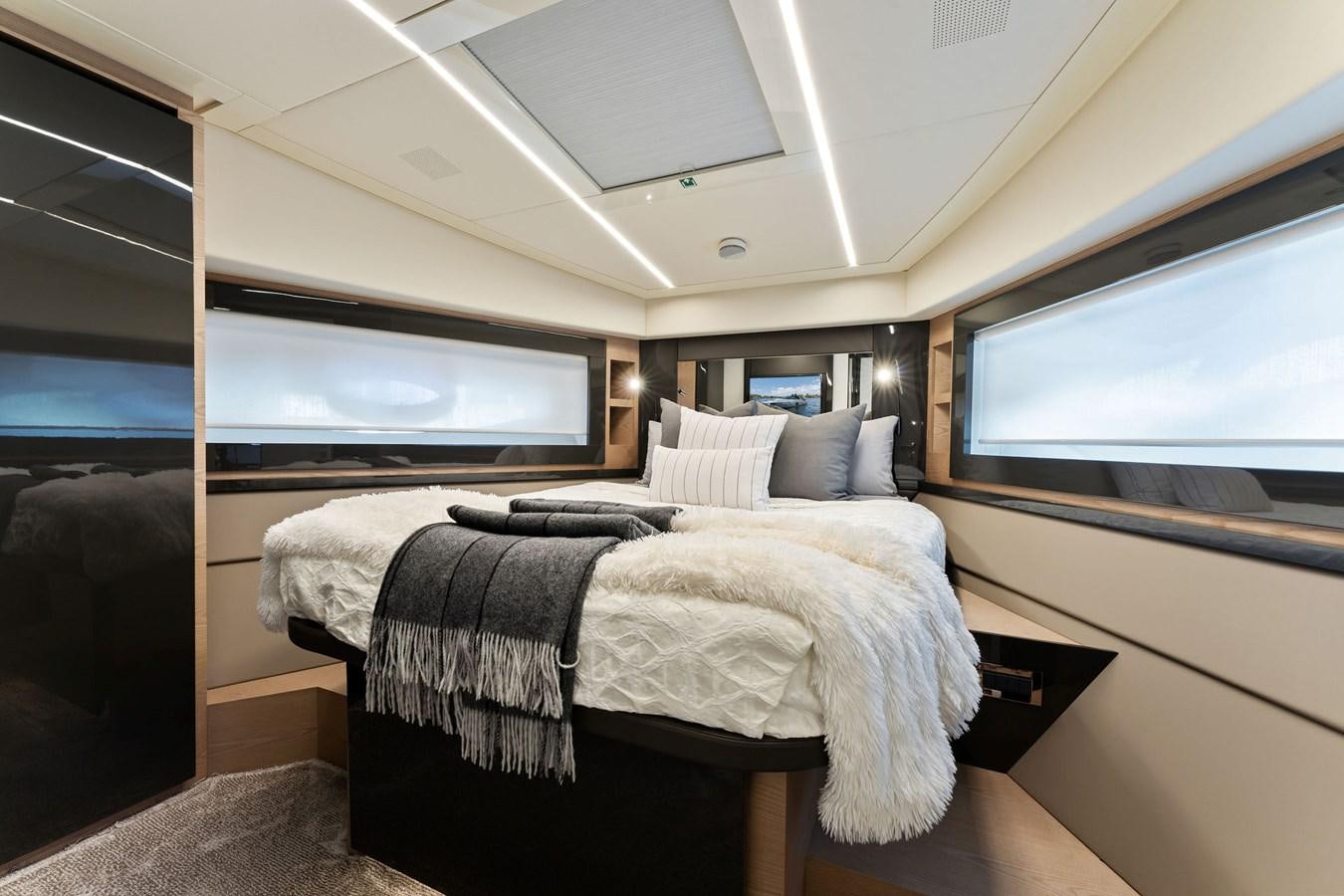 a couple of beds in a room aboard LIQUID Yacht for Sale