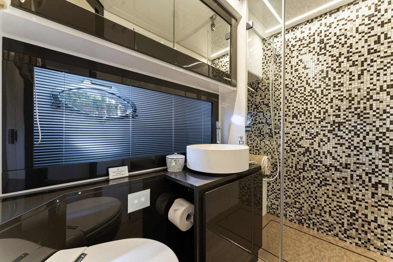 a bathroom with a shower aboard LIQUID Yacht for Sale