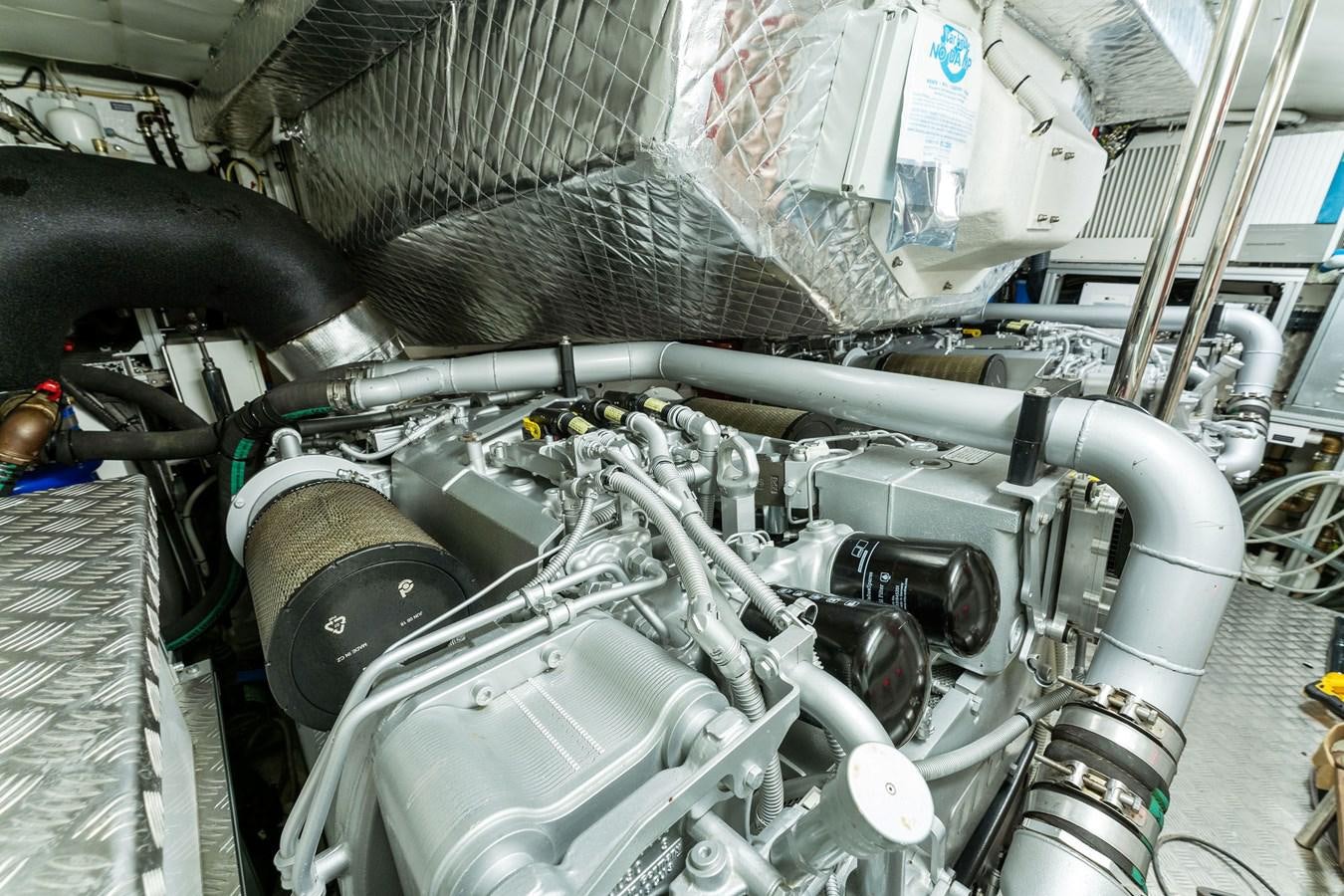 a car engine with a hood aboard LIQUID Yacht for Sale
