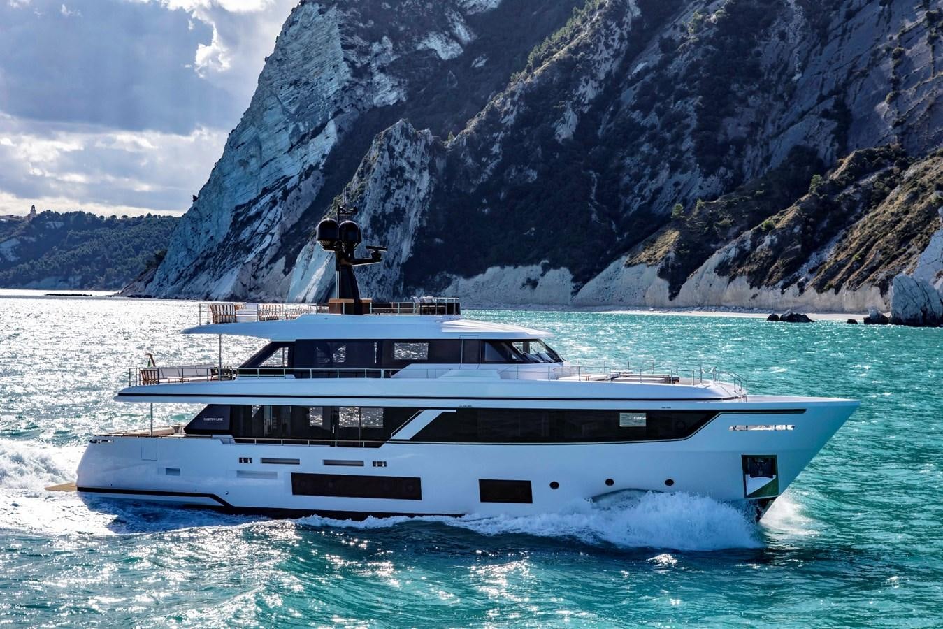 a person standing on a boat in the water aboard NAVETTA 30 Yacht for Sale