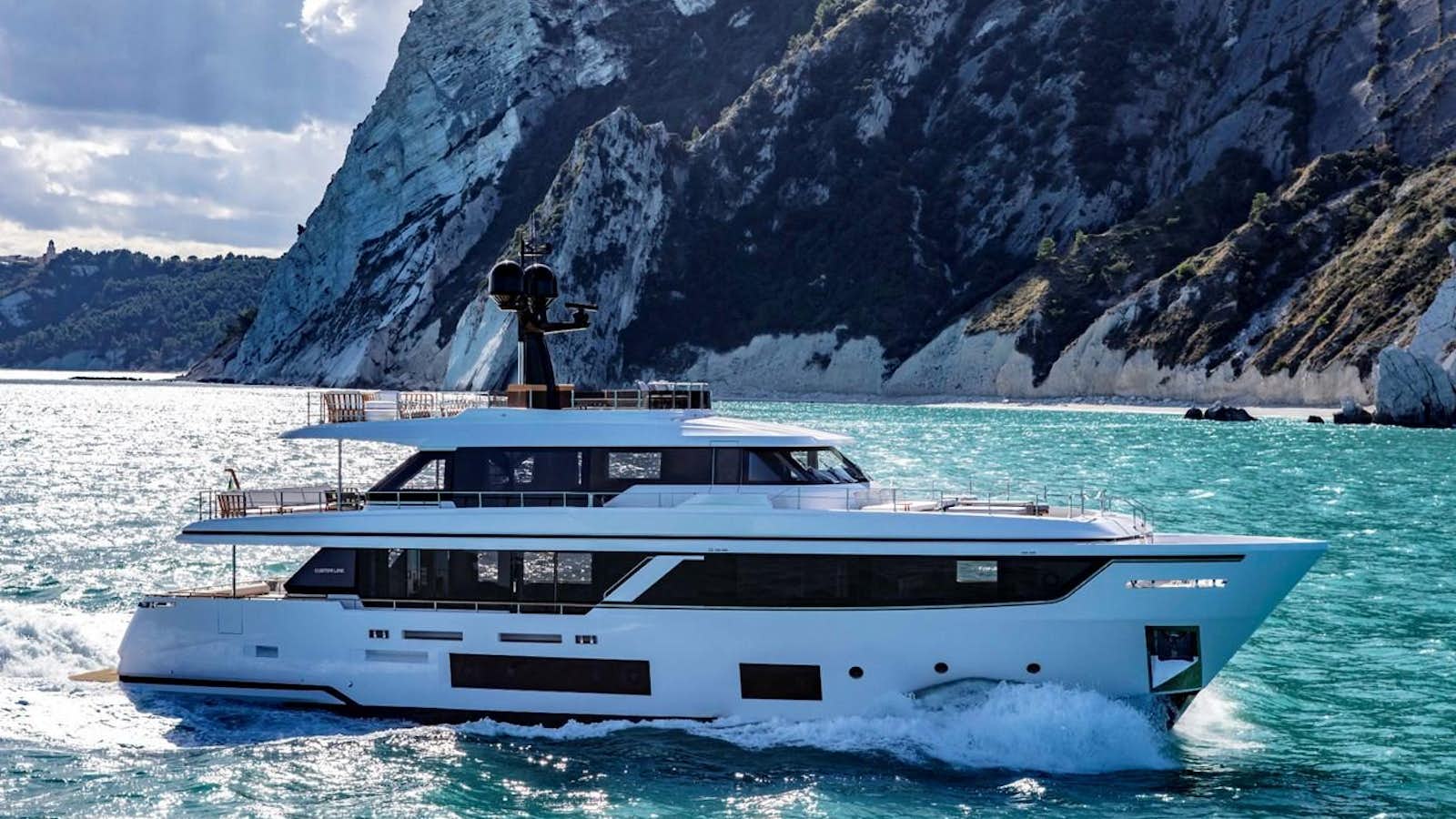 a person standing on a boat in the water aboard NAVETTA 28 Yacht for Sale
