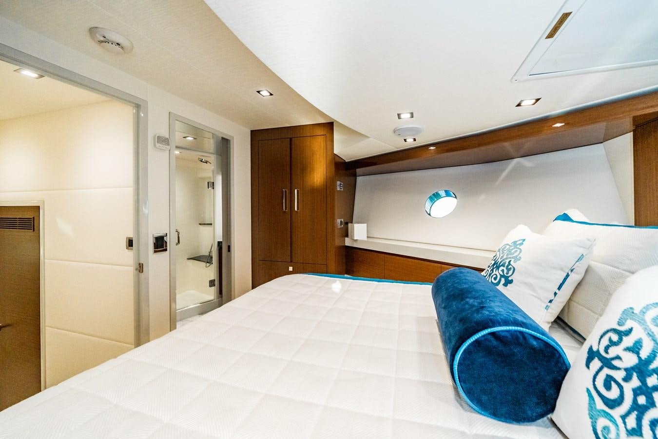 a bed in a room aboard 2017 HATTERAS M75 K SEA Yacht for Sale