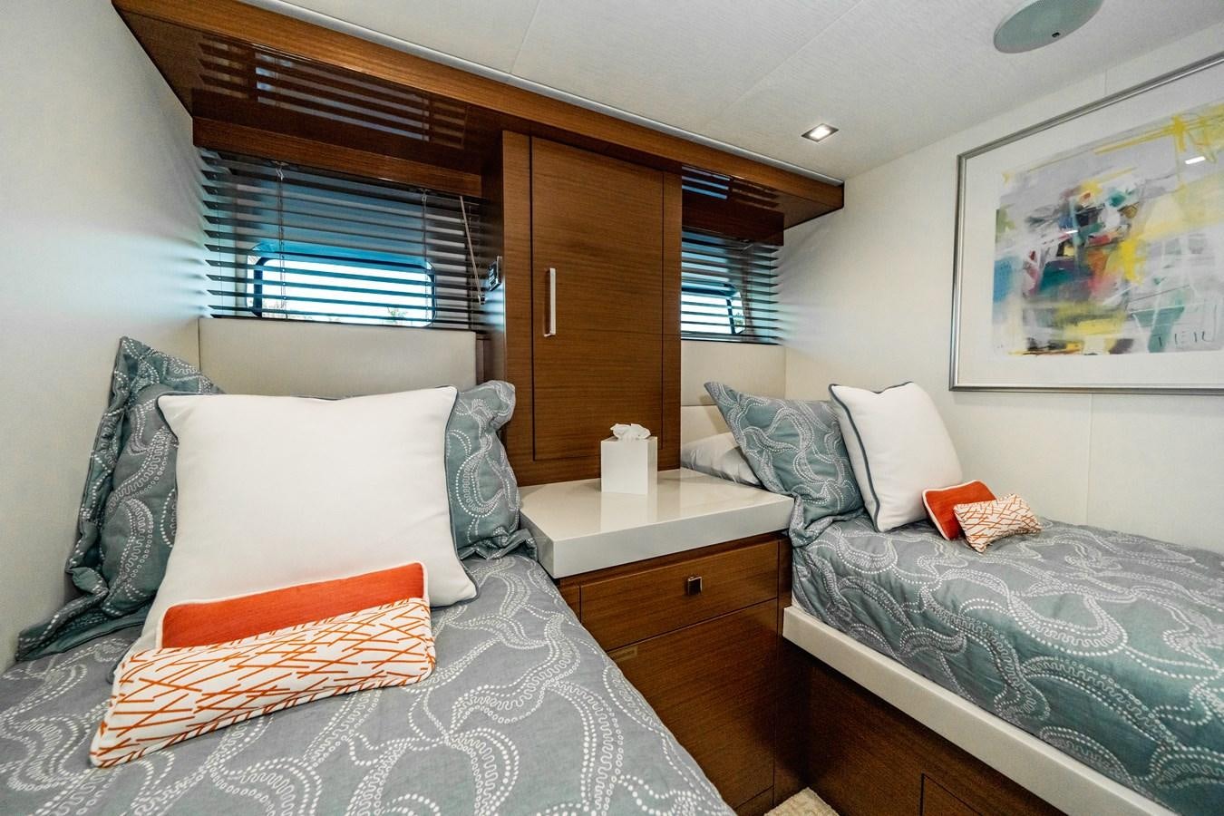 a bed with pillows and pillows aboard 2017 HATTERAS M75 K SEA Yacht for Sale