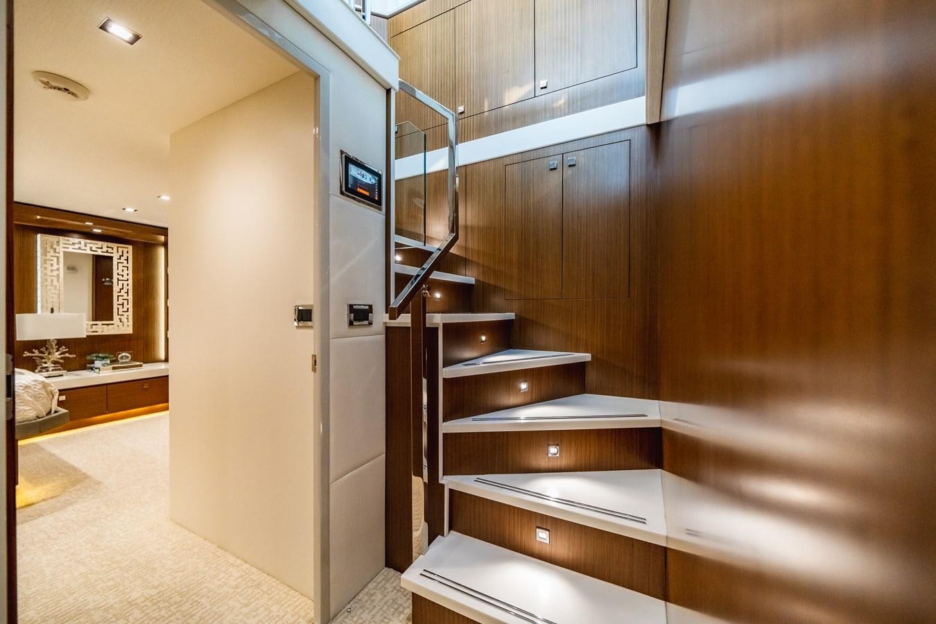 a room with wooden cabinets aboard 2017 HATTERAS M75 K SEA Yacht for Sale