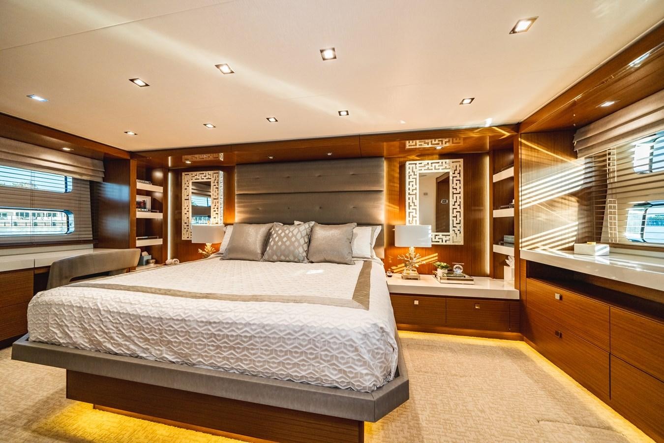 a large bedroom with a large bed aboard 2017 HATTERAS M75 K SEA Yacht for Sale
