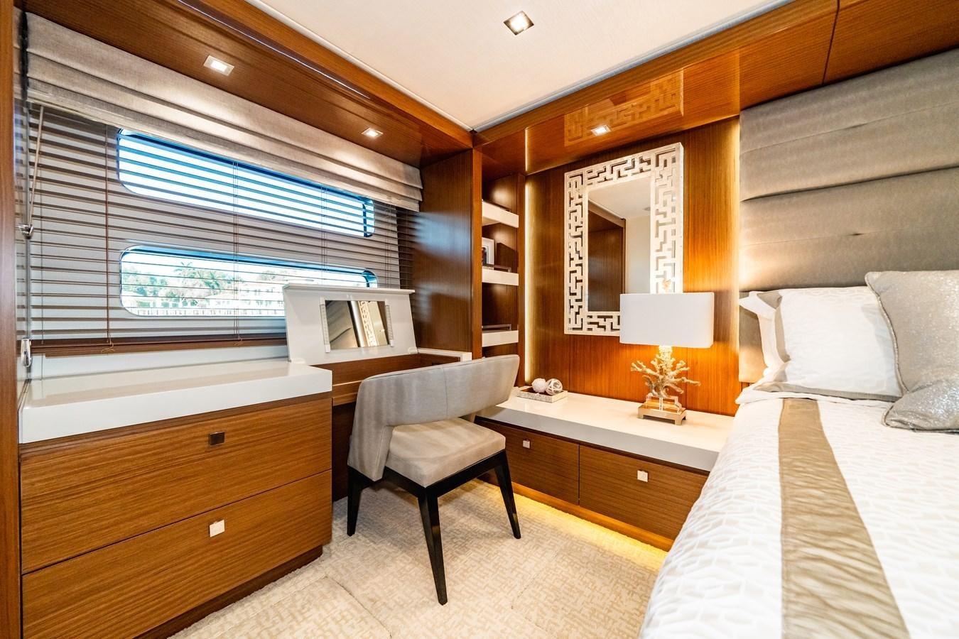 a room with a bed and a chair aboard 2017 HATTERAS M75 K SEA Yacht for Sale