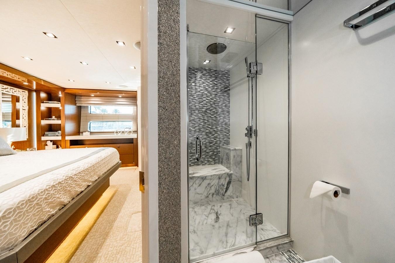 a bathroom with a glass shower aboard 2017 HATTERAS M75 K SEA Yacht for Sale