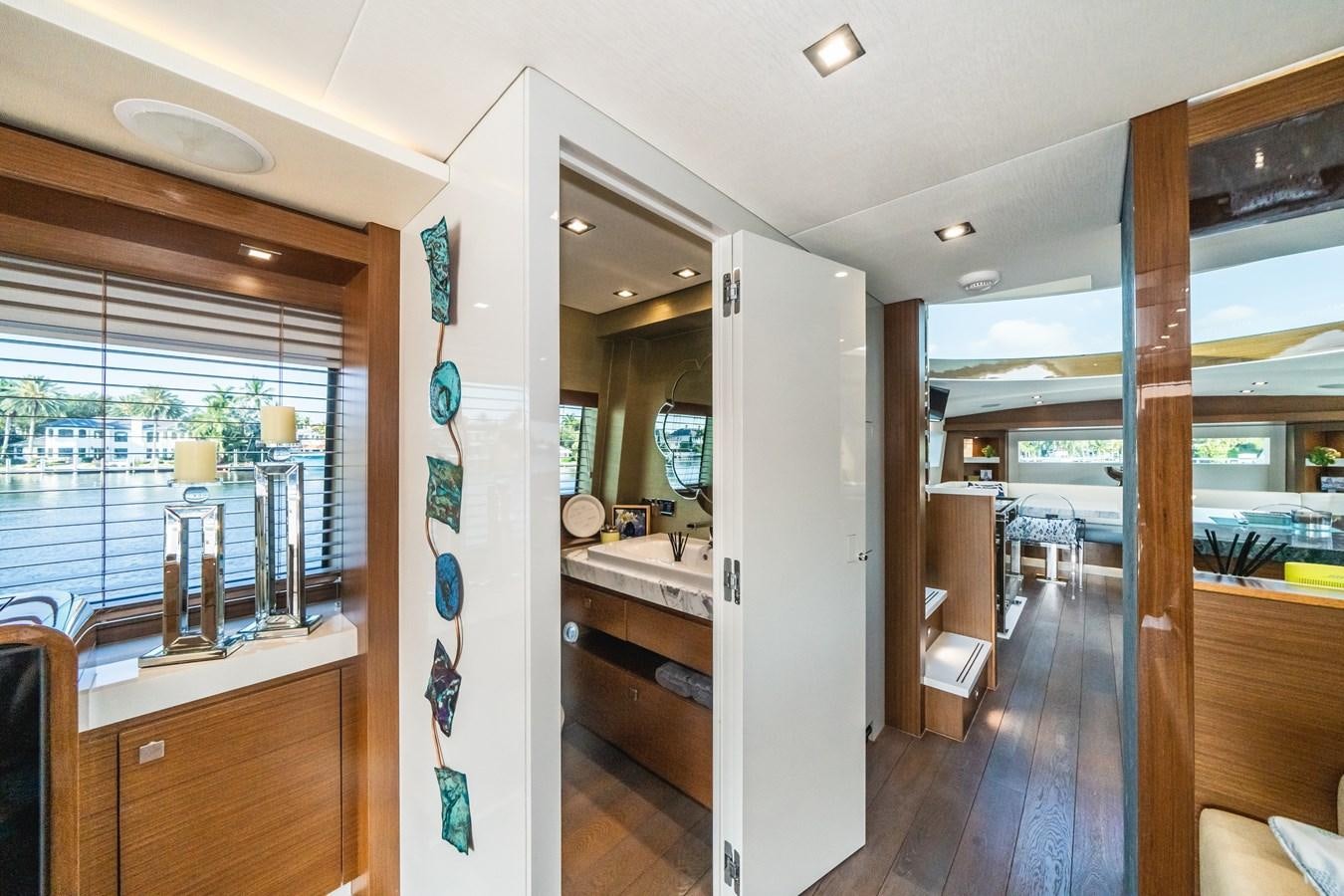 a room with a large glass door aboard 2017 HATTERAS M75 K SEA Yacht for Sale