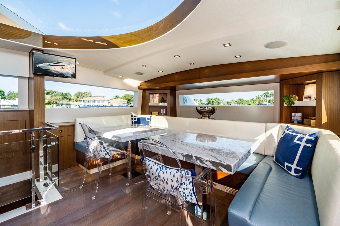 a room with a bed and a couch aboard 2017 HATTERAS M75 K SEA Yacht for Sale