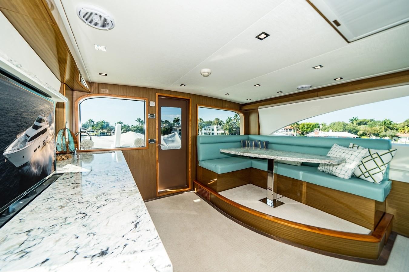 a large room with a pool table aboard 2017 HATTERAS M75 K SEA Yacht for Sale