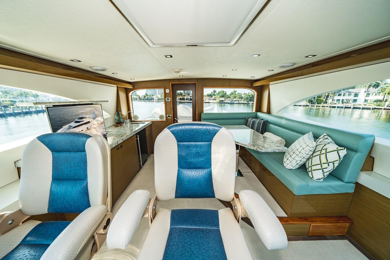inside of a vehicle with a view of the water and the land below aboard 2017 HATTERAS M75 K SEA Yacht for Sale