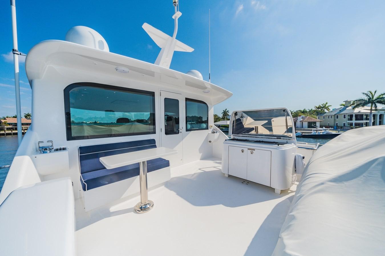 a boat on the water aboard 2017 HATTERAS M75 K SEA Yacht for Sale