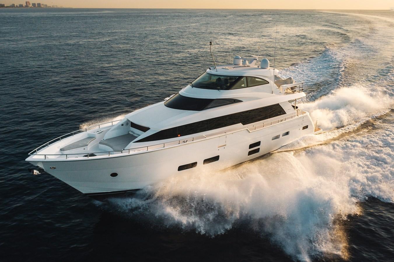 a white yacht on the water aboard 2017 HATTERAS M75 K SEA Yacht for Sale