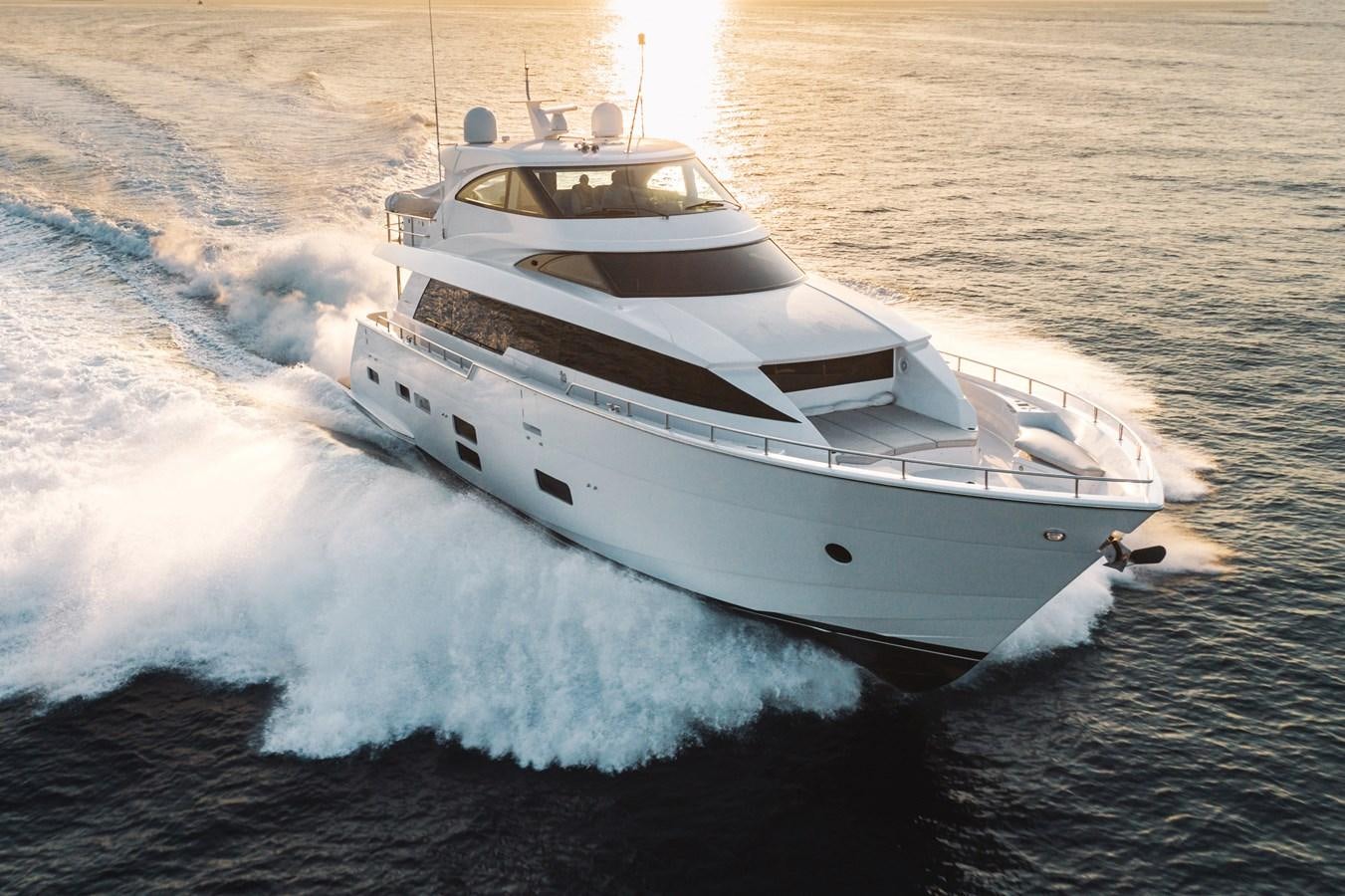 a white yacht on the water aboard 2017 HATTERAS M75 K SEA Yacht for Sale