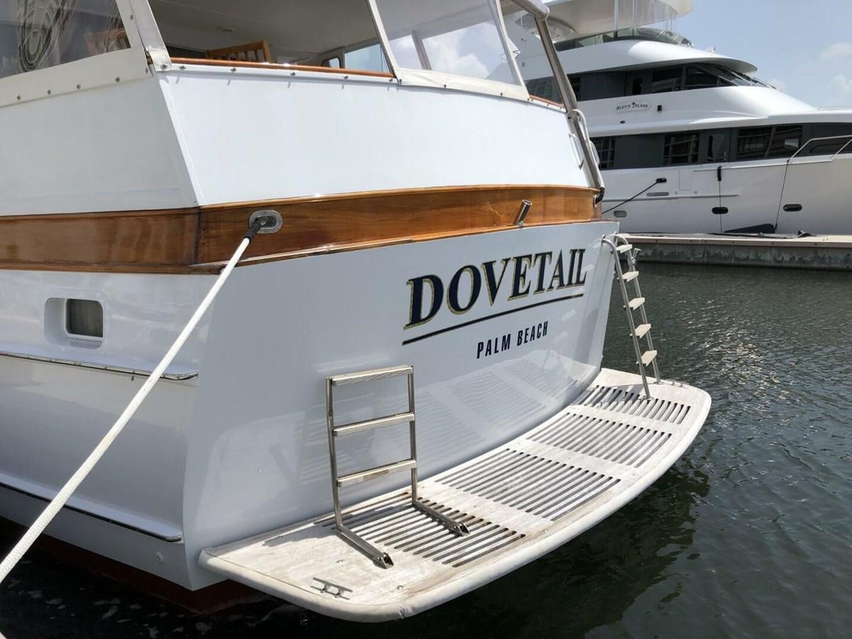 a boat docked at a pier aboard DOVETAIL Yacht for Sale