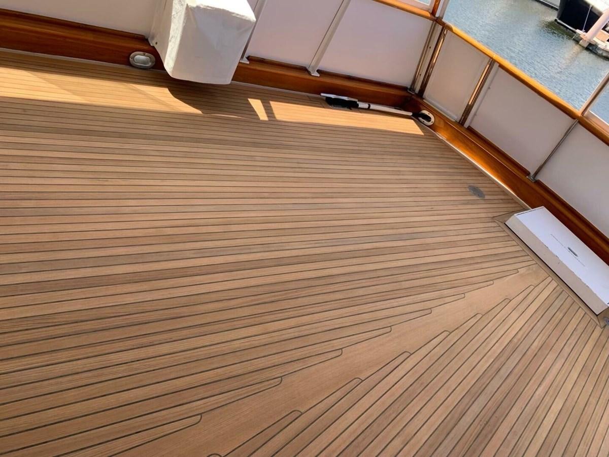 a wooden floor with a hole in it aboard DOVETAIL Yacht for Sale