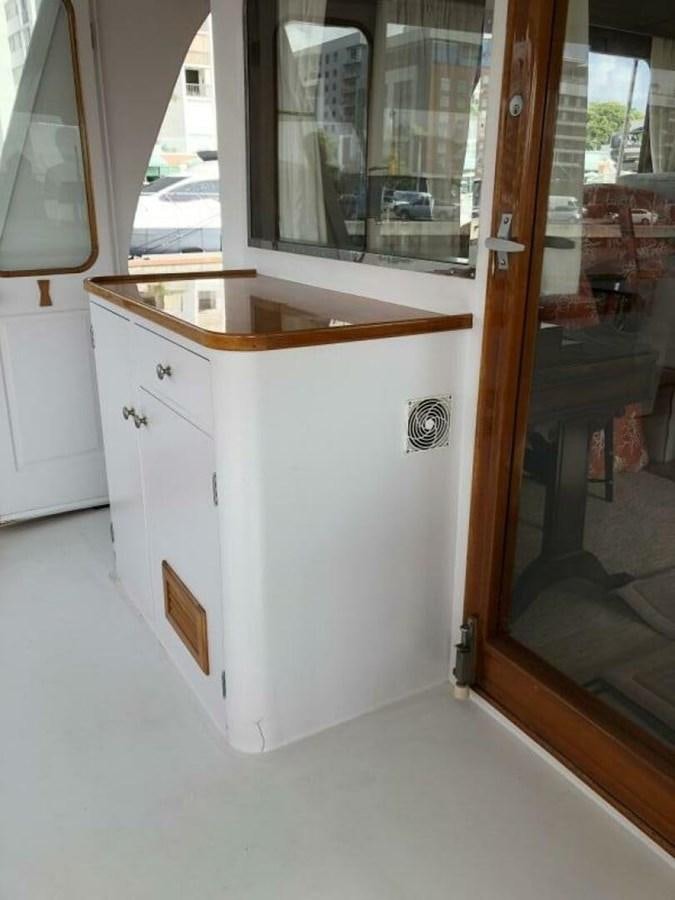 a white cabinet in a room aboard DOVETAIL Yacht for Sale