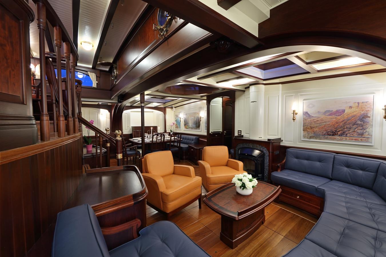 a room with a couch and a coffee table aboard ASGARD Yacht for Sale