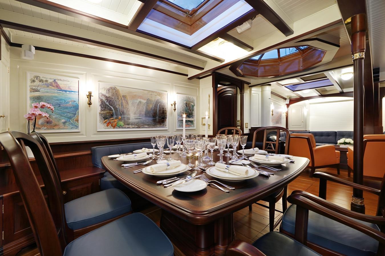 a dining room with a table set aboard ASGARD Yacht for Sale