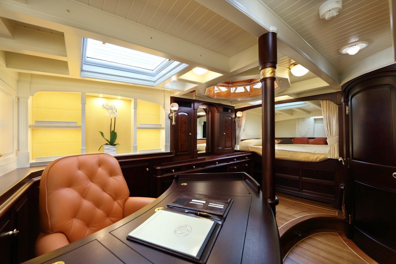 a person sitting at a table aboard ASGARD Yacht for Sale