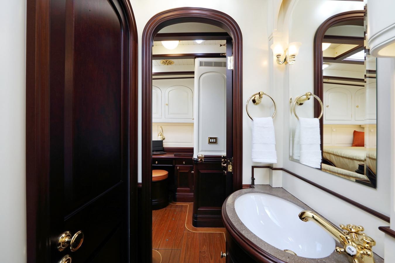 a bathroom with a large mirror aboard ASGARD Yacht for Sale
