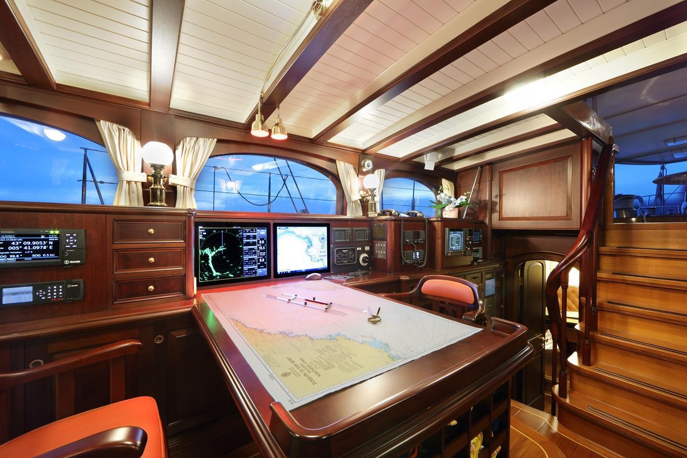 a room with a table and chairs aboard ASGARD Yacht for Sale
