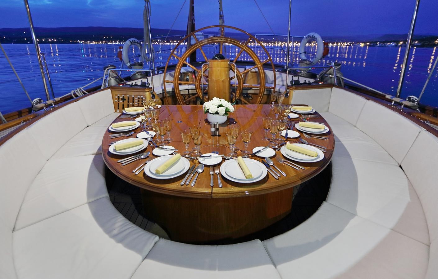 a table with plates and food on it aboard ASGARD Yacht for Sale