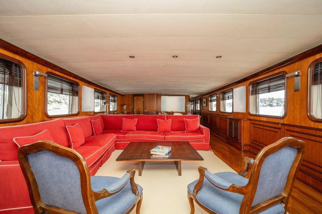 a train with red seats aboard CLASSIC 40M BENETTI Yacht for Sale