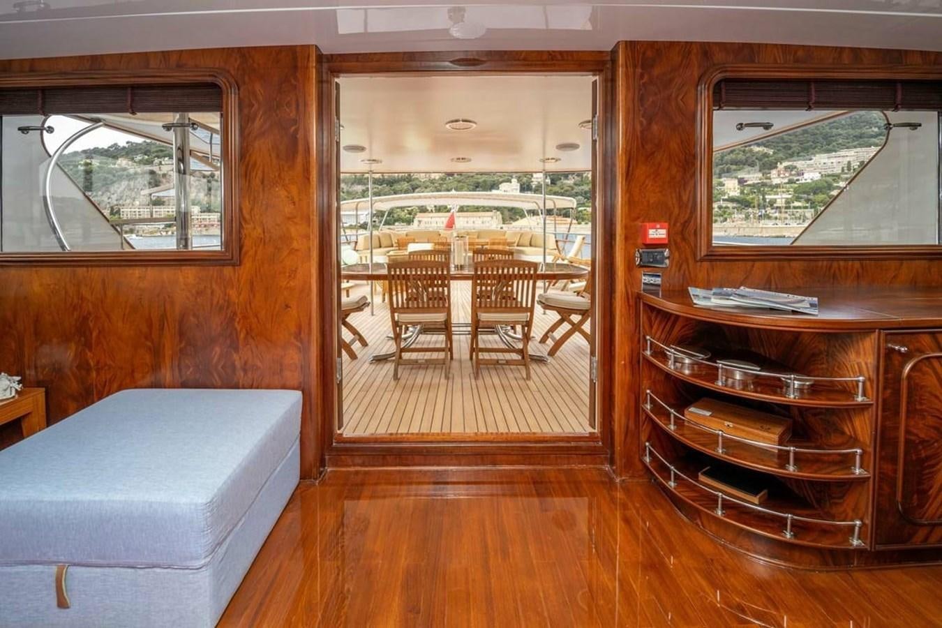 a living room with a wood floor aboard CLASSIC 40M BENETTI Yacht for Sale