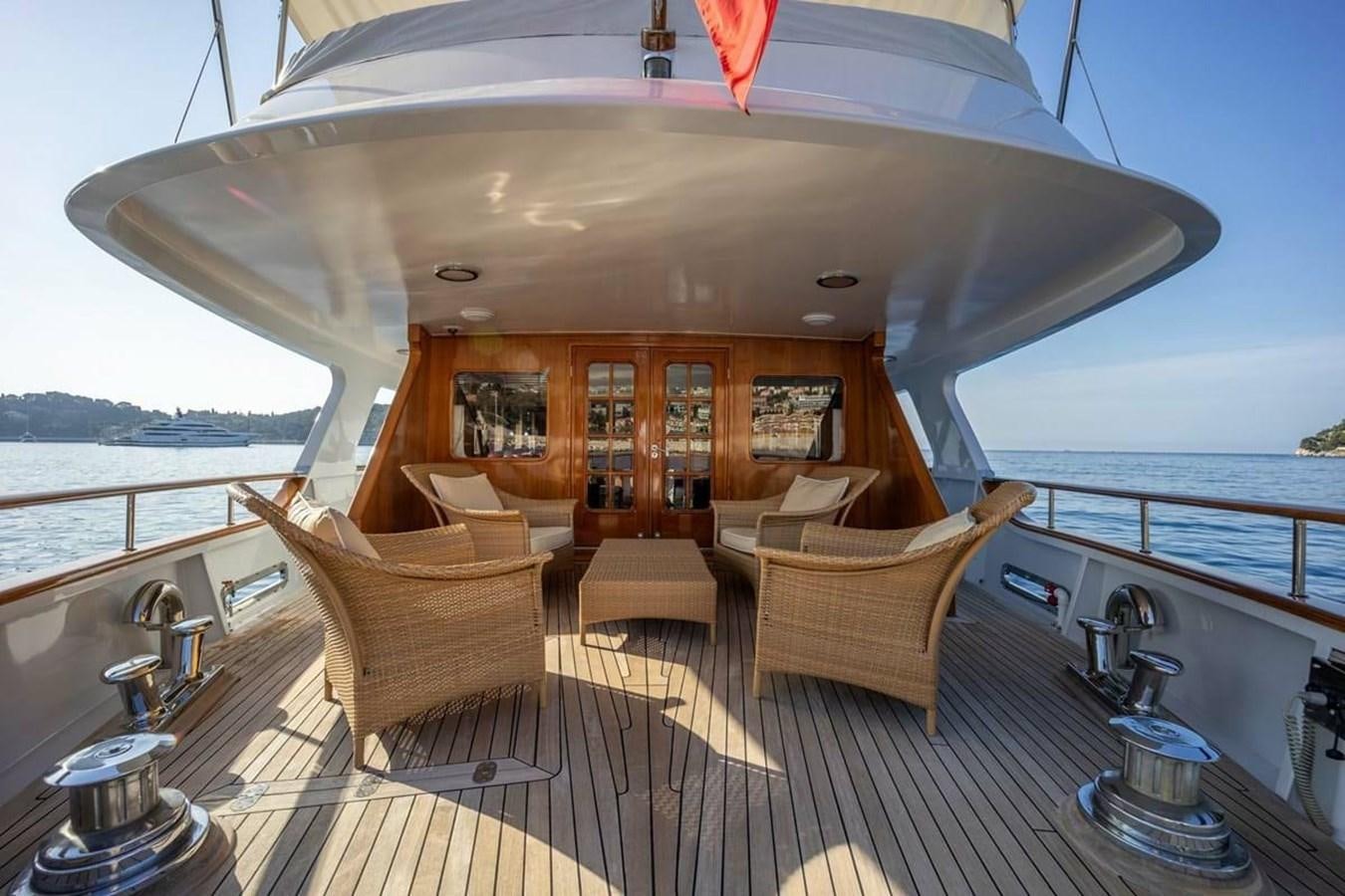 a large living room with a large open window aboard CLASSIC 40M BENETTI Yacht for Sale