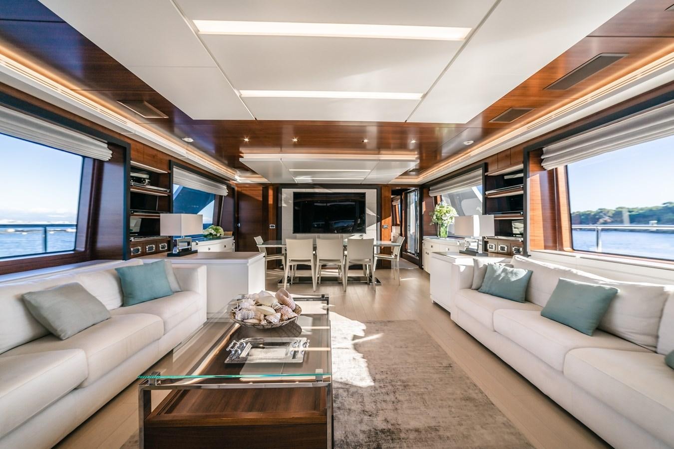 a living room with a couch and a coffee table aboard ADEL Yacht for Sale