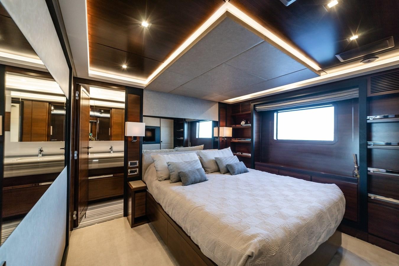 a bed in a room aboard ADEL Yacht for Sale