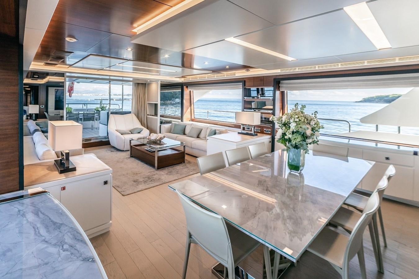 a living room with a large window aboard ADEL Yacht for Sale