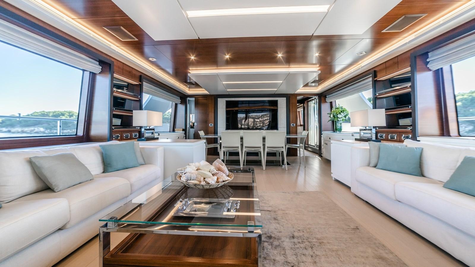 a living room with a couch and a coffee table aboard ADEL Yacht for Sale