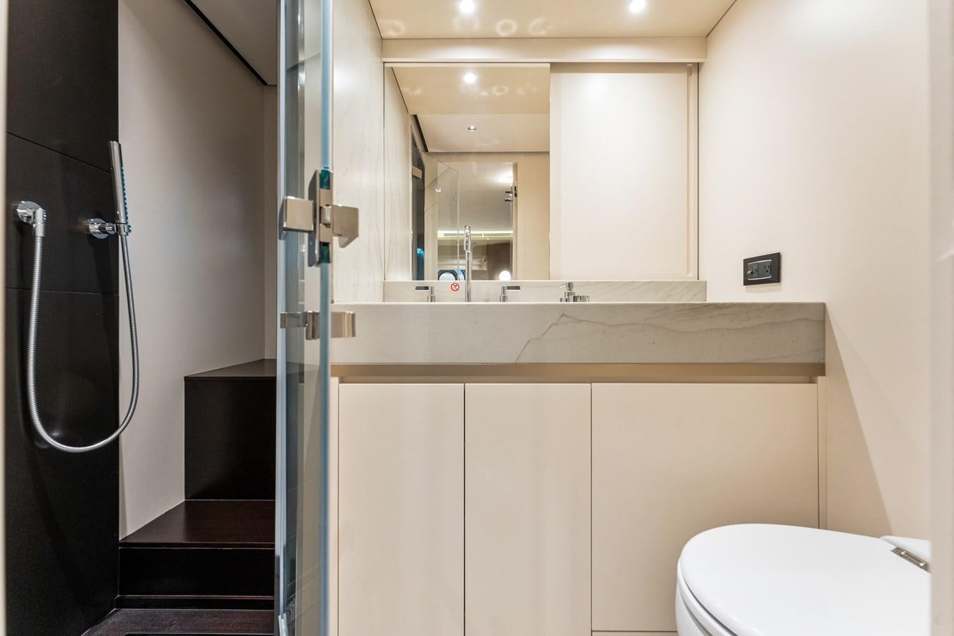 a bathroom with a glass shower aboard EQUITES Yacht for Sale