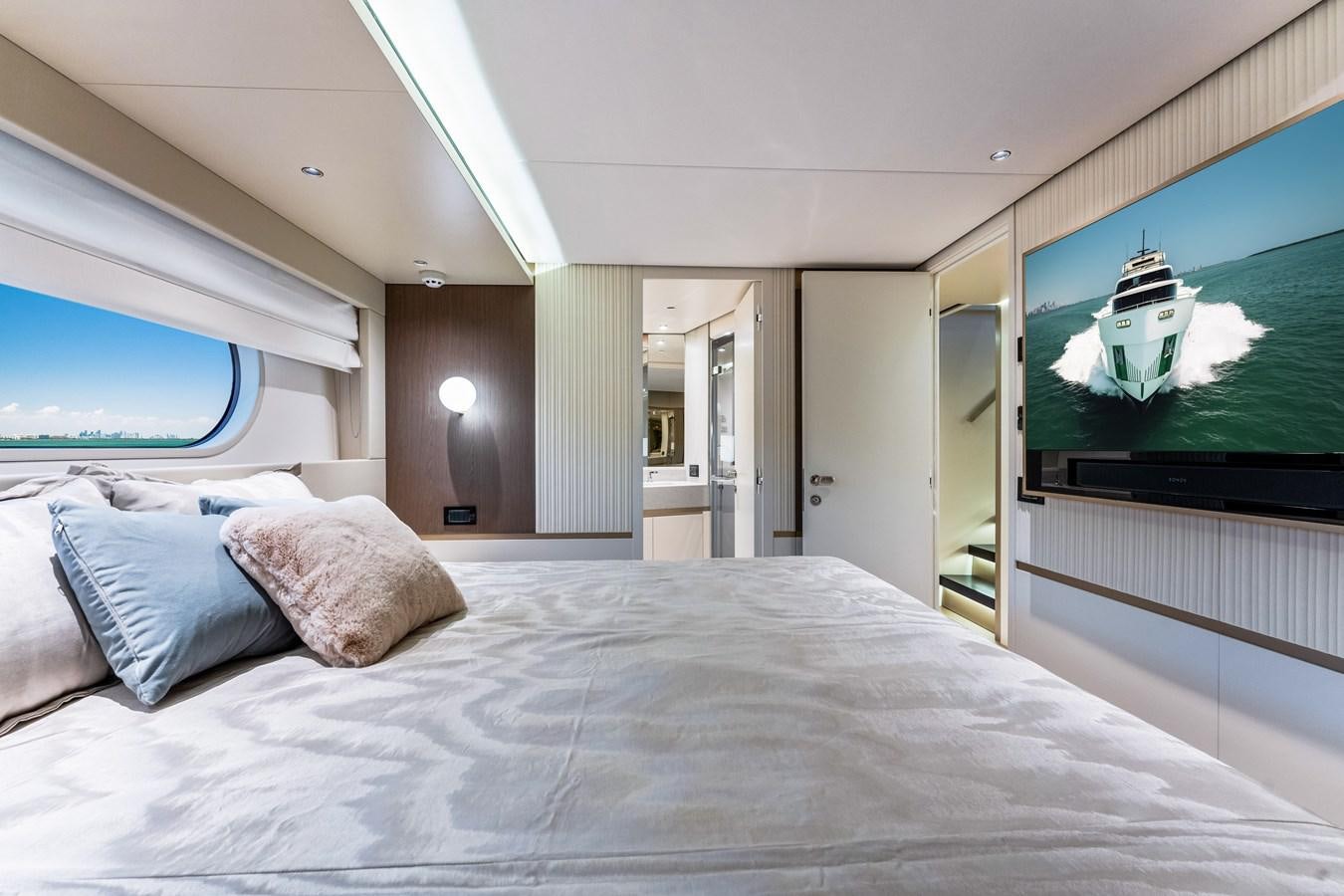 a bed with a television on aboard EQUITES Yacht for Sale