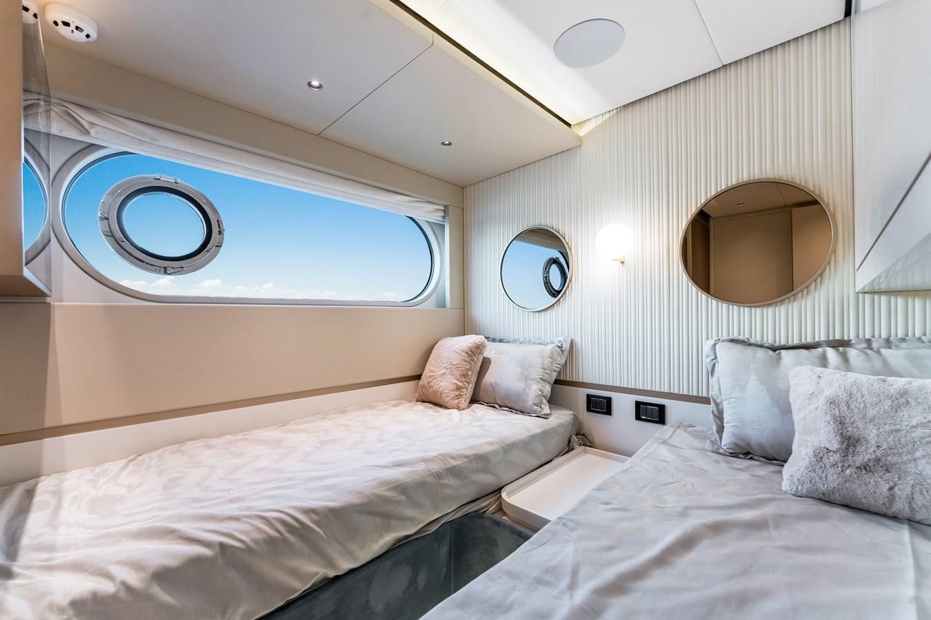 a room with two beds aboard EQUITES Yacht for Sale