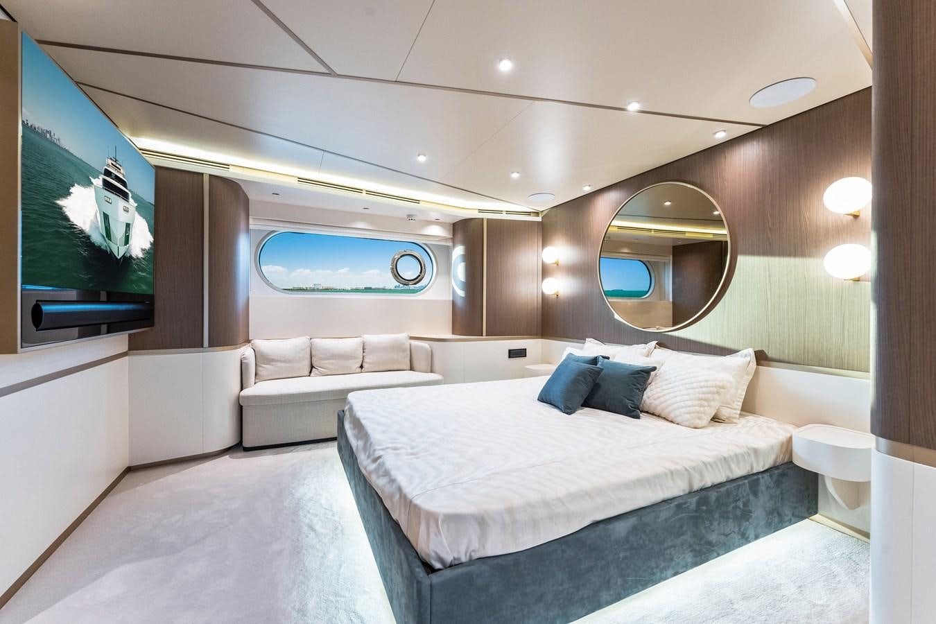 a room with a bed and a tv aboard EQUITES Yacht for Sale