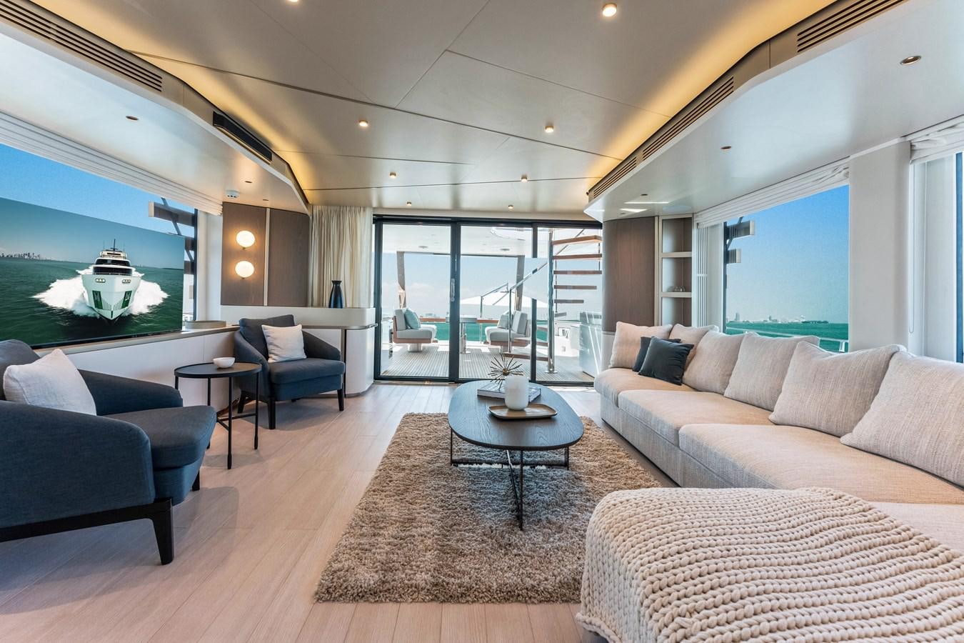 a living room with a large window aboard EQUITES Yacht for Sale