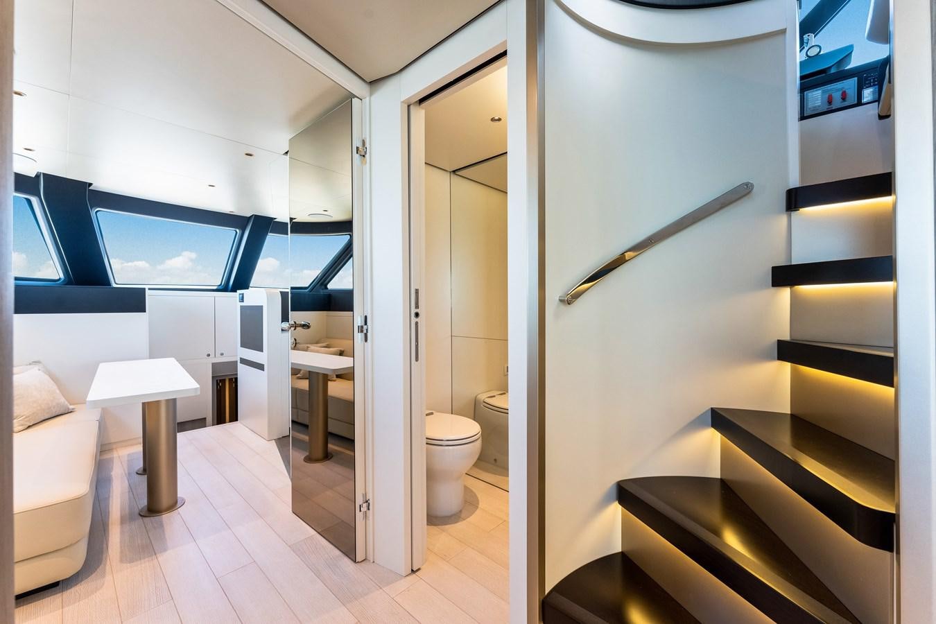 a room with a toilet and a staircase aboard EQUITES Yacht for Sale