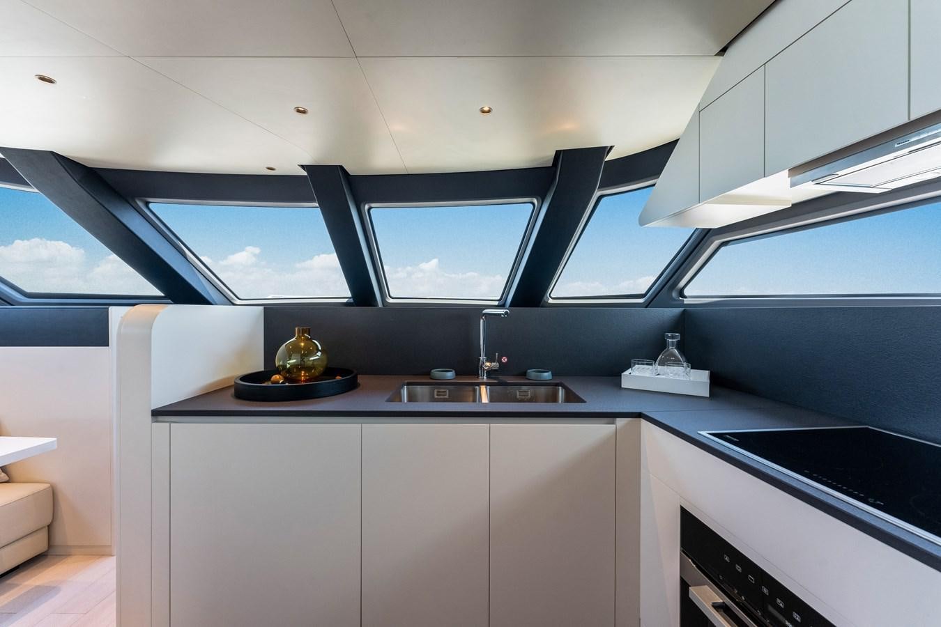 a room with a desk and a window aboard EQUITES Yacht for Sale