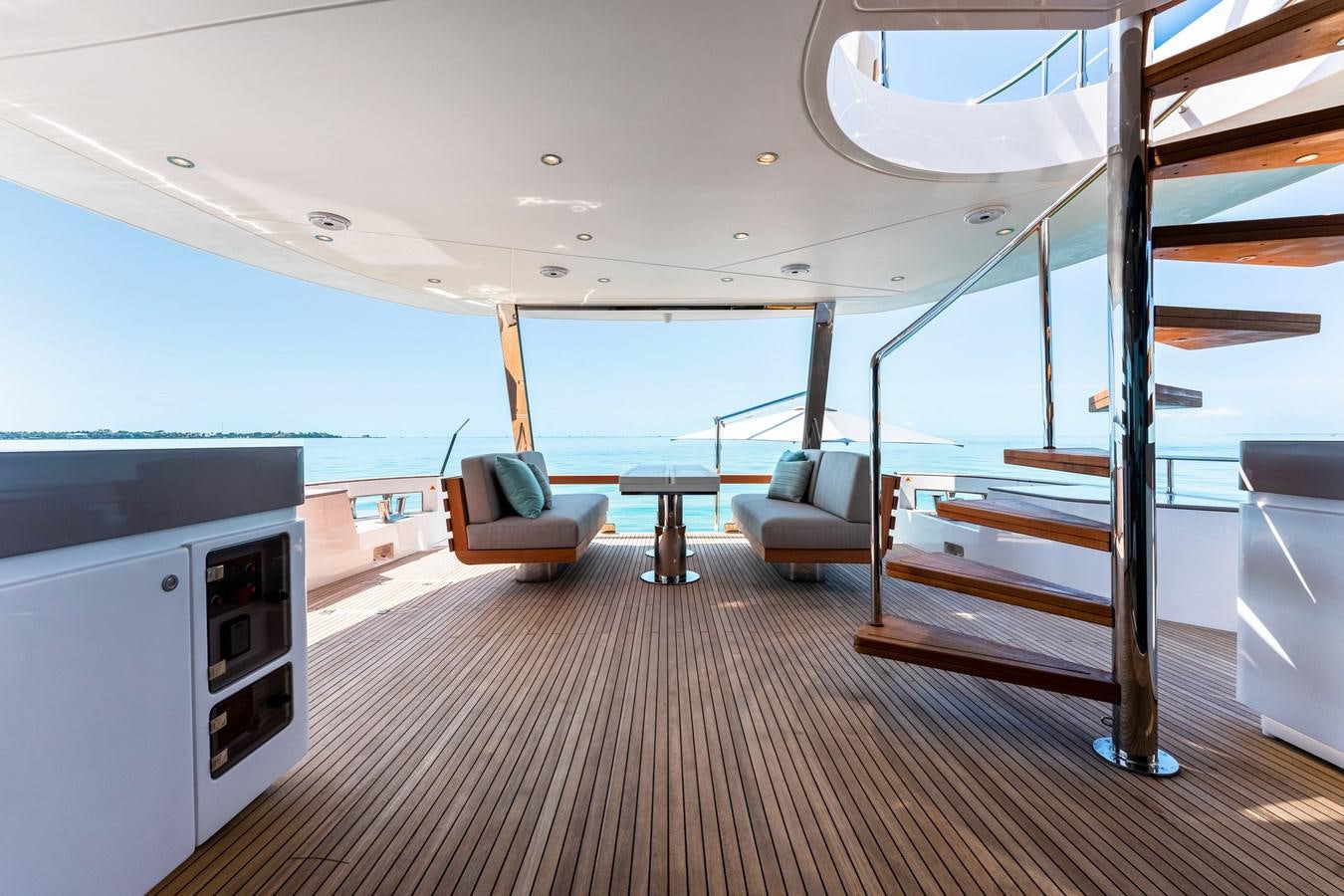 a room with a bed and a couch aboard EQUITES Yacht for Sale