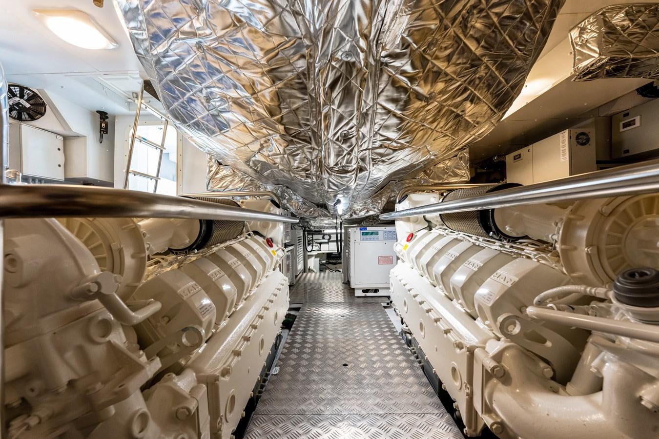 a large room with pipes and machinery aboard EQUITES Yacht for Sale