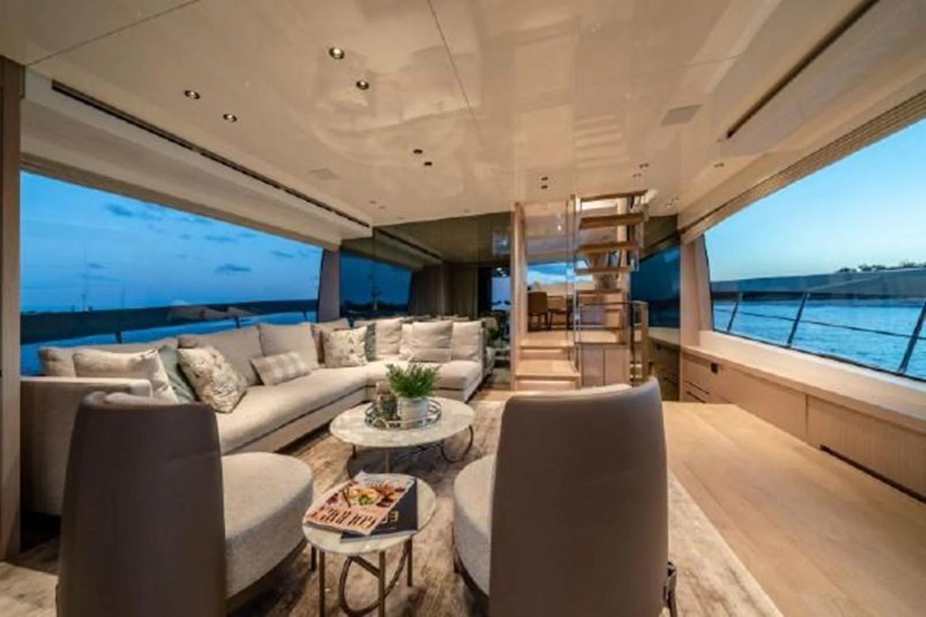 a living room with a large window aboard SANLORENZO SX76 Yacht for Sale