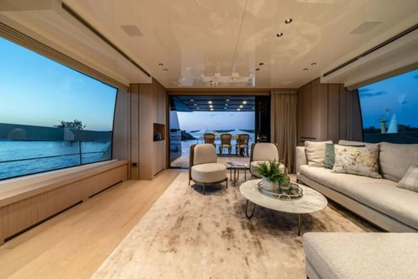 a living room with a large window aboard SANLORENZO SX76 Yacht for Sale