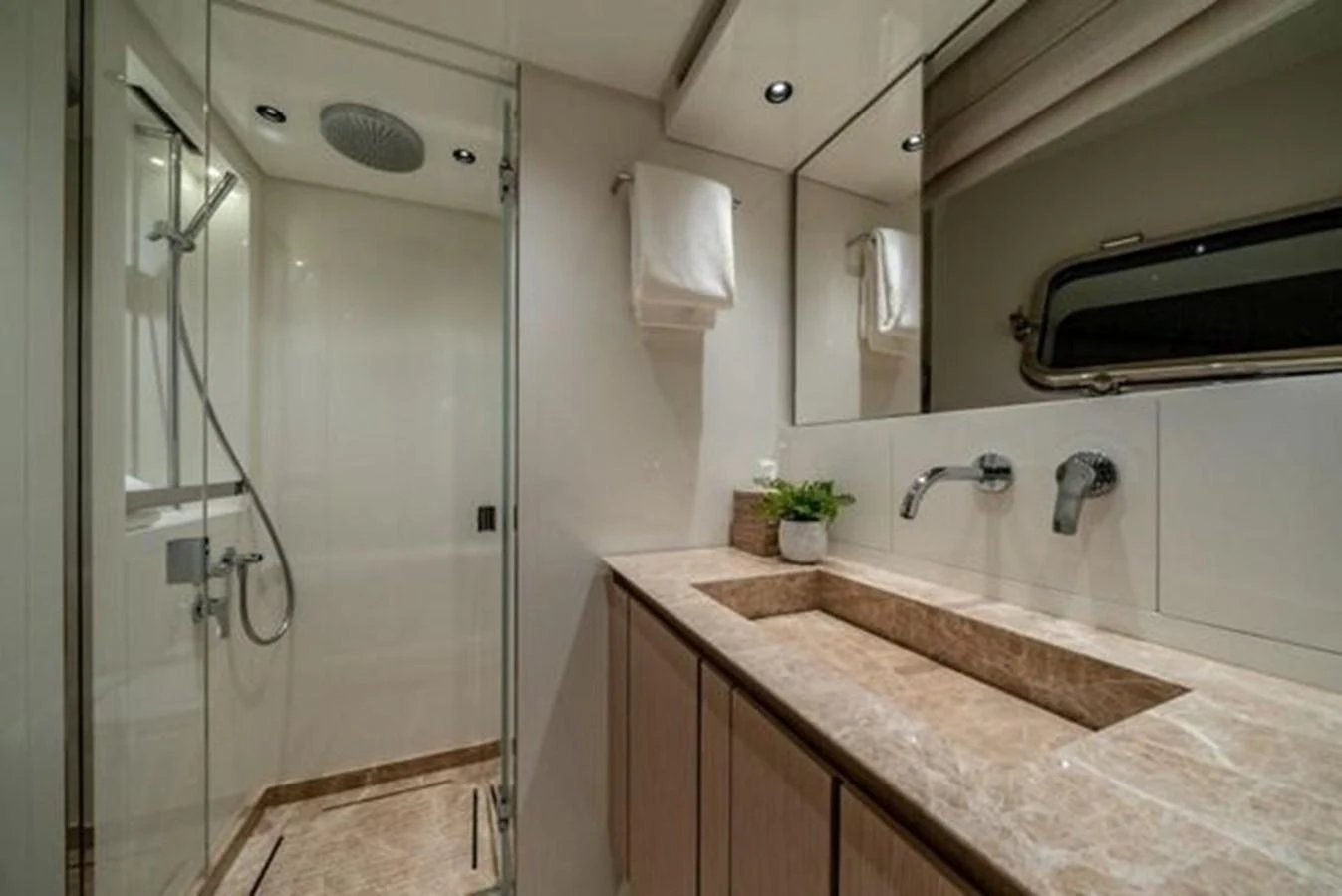 a bathroom with a countertop sink and a shower unit aboard SANLORENZO SX76 Yacht for Sale